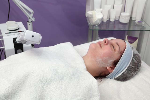 Beauty treatment of young female face, ozone facial steamer