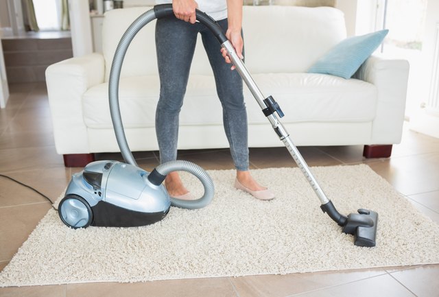 Woman hovering rug