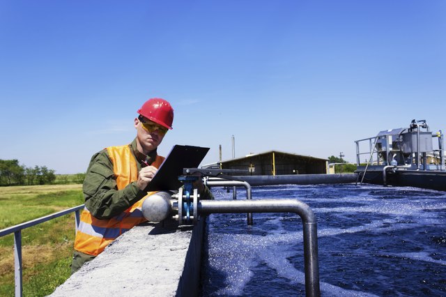 Worker inspecting valve