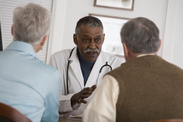 Doctor conversing with patients