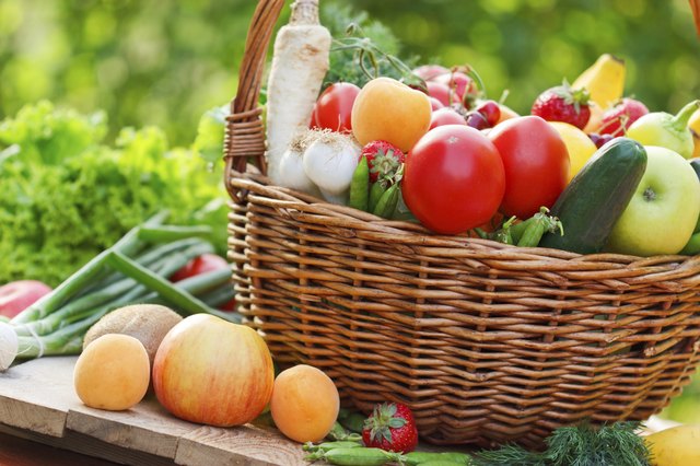 Basket full of fruits and vegetables on the table