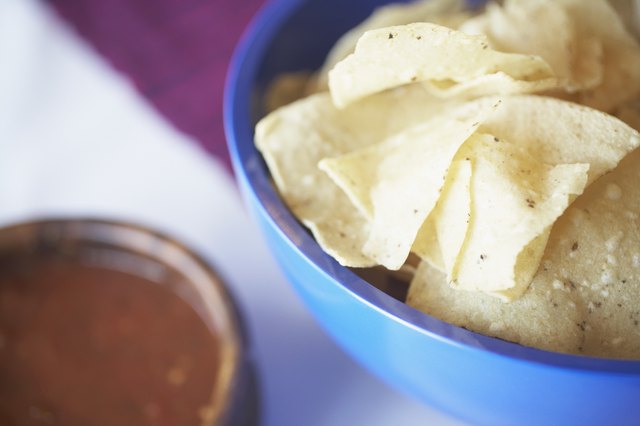Tortilla chips and salsa, elevated view (focus on tortillas chips)
