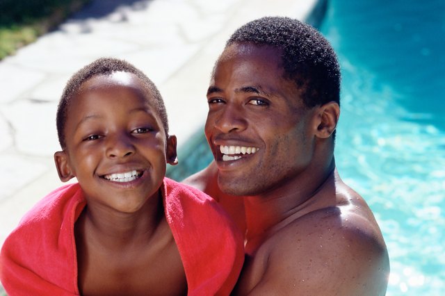 Father and son by pool