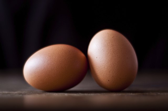 Two eggs on wooden table