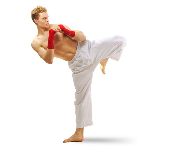 Man training taekwondo Isolated on white background