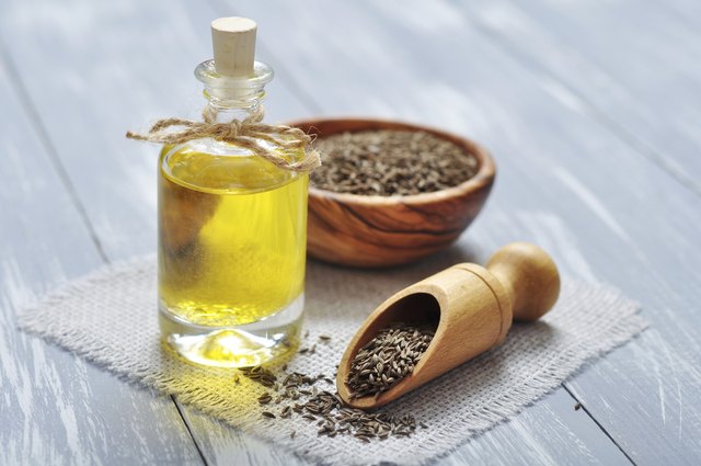 cumin oil in a glass bottle