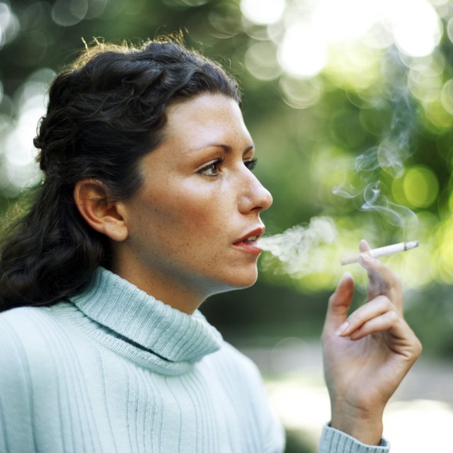 portrait of a young woman smoking a cigarette