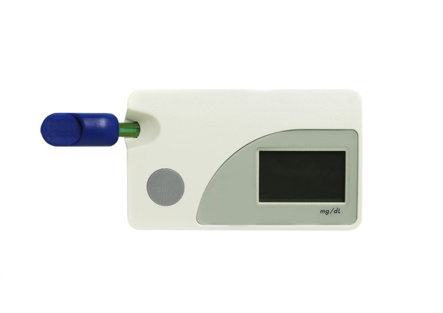 Blood glucose testing kit on white background