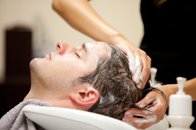 Handsome man shampooed
