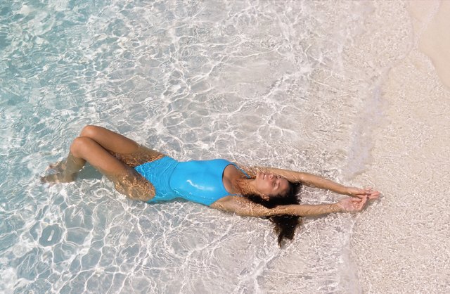 Woman sunbathing on beach