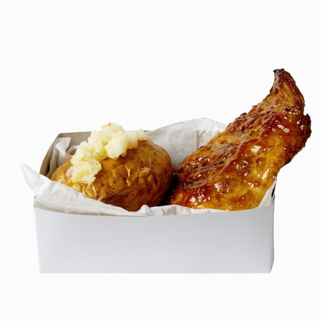 Close-up of a carton of mashed potato and spare ribs