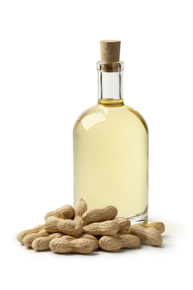 bottles of peanut oil with nuts
