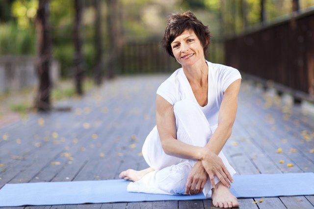 middle aged woman relaxing after workout