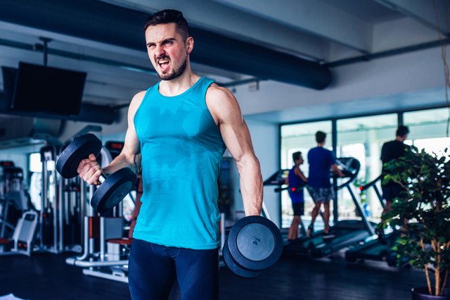 Crossfit instructor at the gym doing Exercise