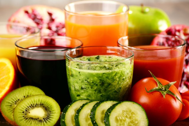 Glasses with fresh organic vegetable and fruit juices