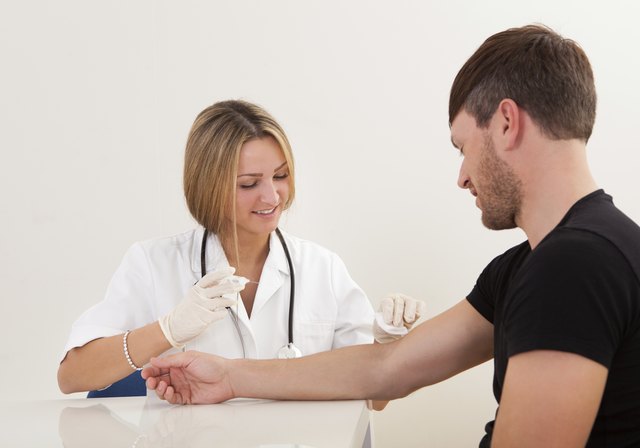 Nurse making injection to patient