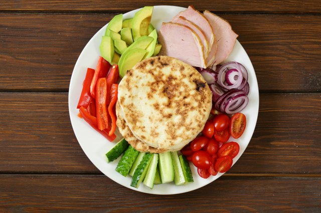 homemade tortillas pita stuffed with vegetables and meat