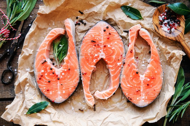 Raw salmon steaks with herbs