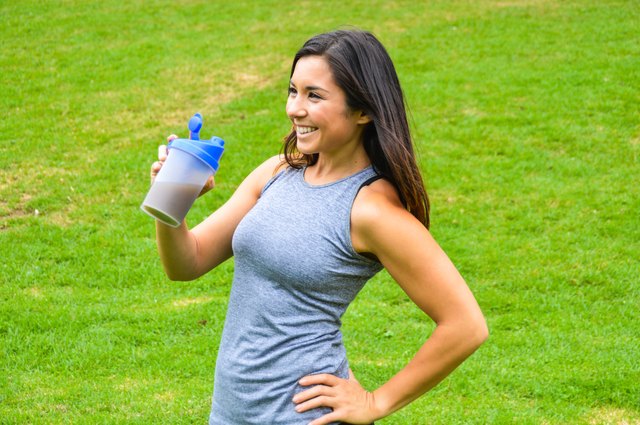 Woman drinking a meal replacement shake (protein shake)