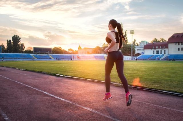 Runner - woman training.Female fitness concept