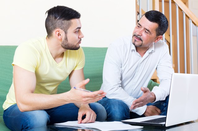 two men with documents