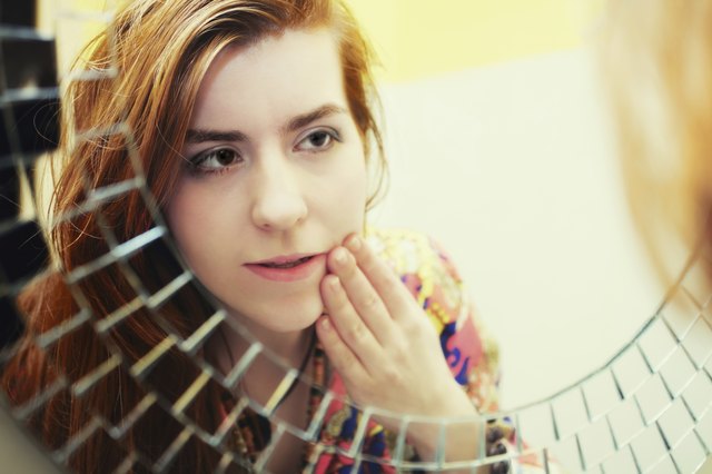 Red-haired girl doing morning makeup