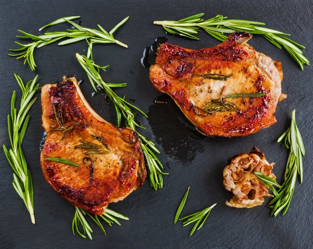 Roasted pork steaks, fresh rosemary and garlic