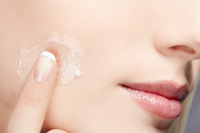 girl rubbing cream
