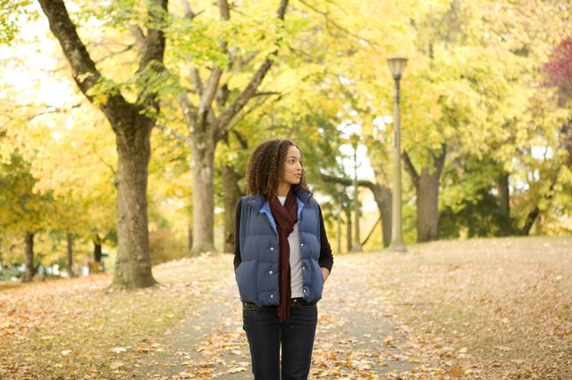 Young woman walking in park, portrait