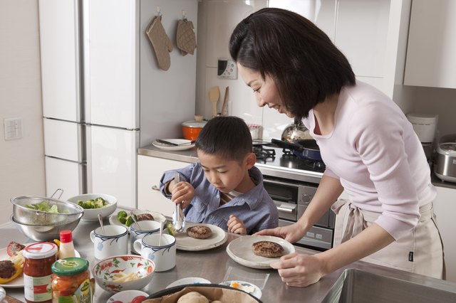 Boy Arranging Dishes on Plate