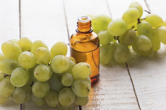 Fresh grape and seed oil in bottle