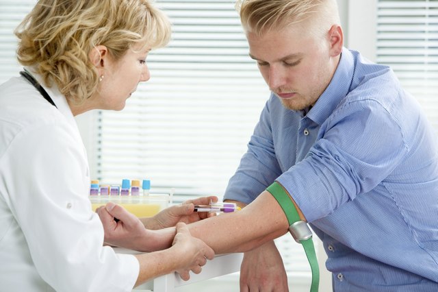 Nurse taking blood sample