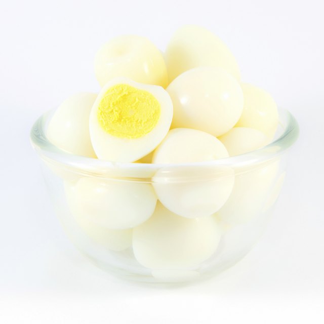 Boiled quail eggs on white background