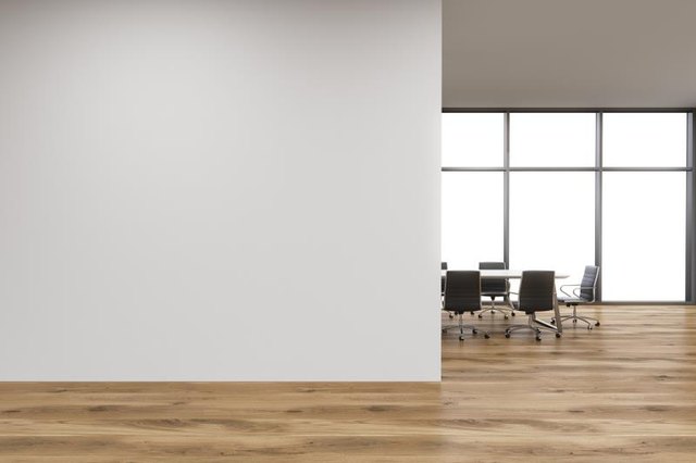 Empty office, white wall in front of panoramic window, table for meetings, wooden wall. Concept of new office. 3D rendering