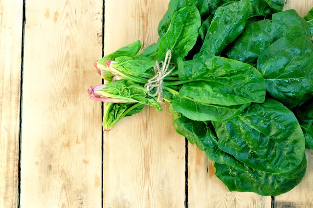 Spinach on the wooden table