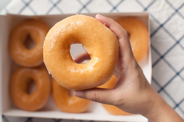 Hand picking donuts