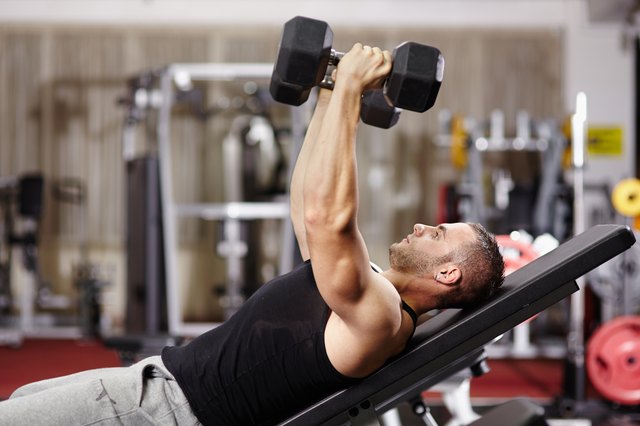 Athletic man working his chest
