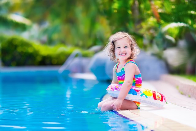 Sweet little girl in swimming pool