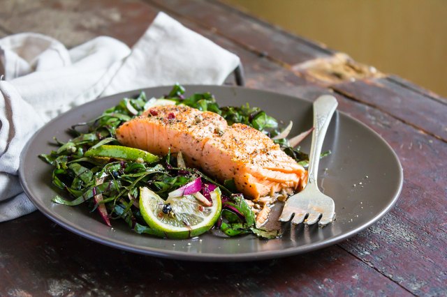 Roasted salmon fillet with fresh salad with onion