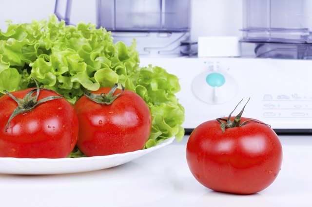 Tomatoes with green salad and kitchen processor