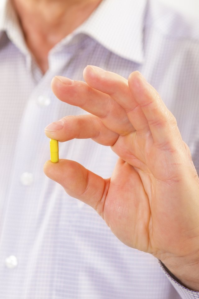 Senior man taking pill