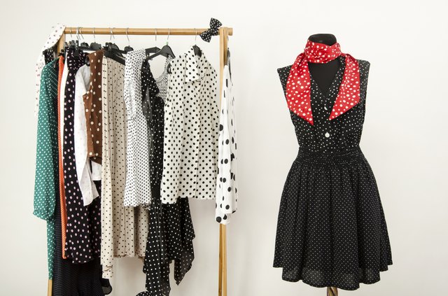 Colorful wardrobe with polka dots clothes and accessories.