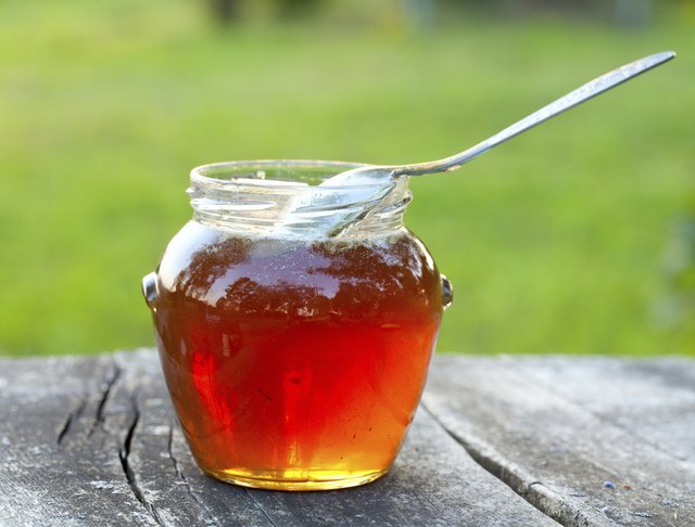 honey on wooden garden table