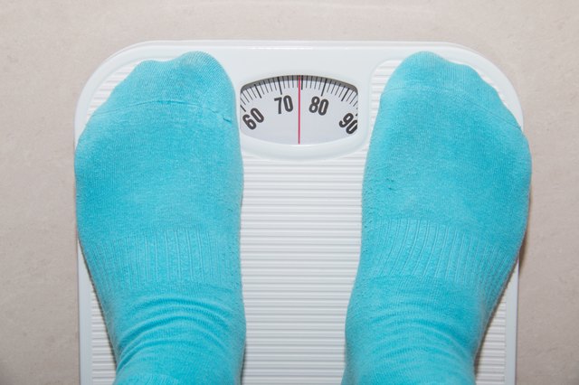 Closeup of a Asians weighed