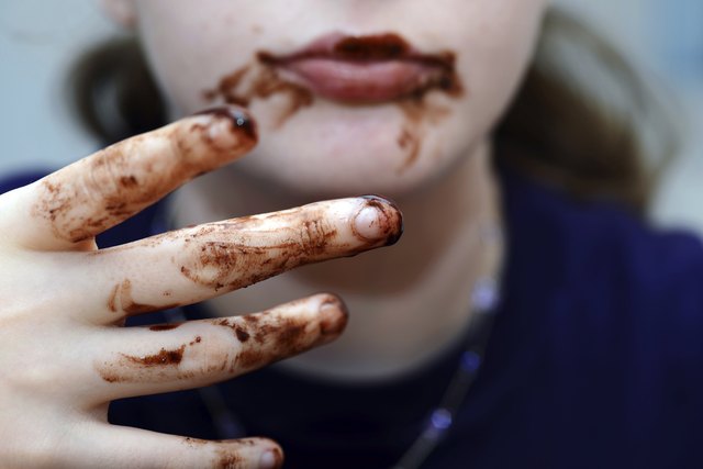 Girl eating chocolate