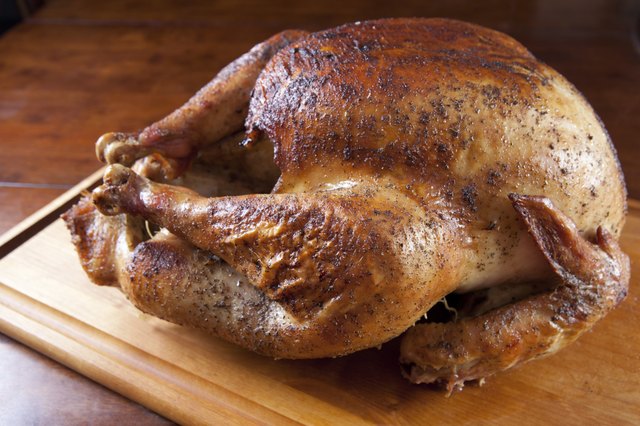 Roasted Turkey Resting on Wooden Board