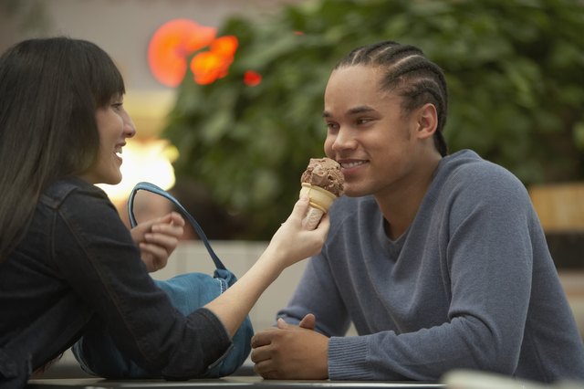 Teenage couple sitting at a table
