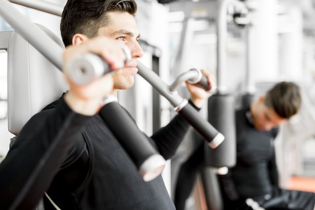 Young handsome man working out in a gym