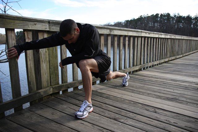 Athletic Male Runner Stretching