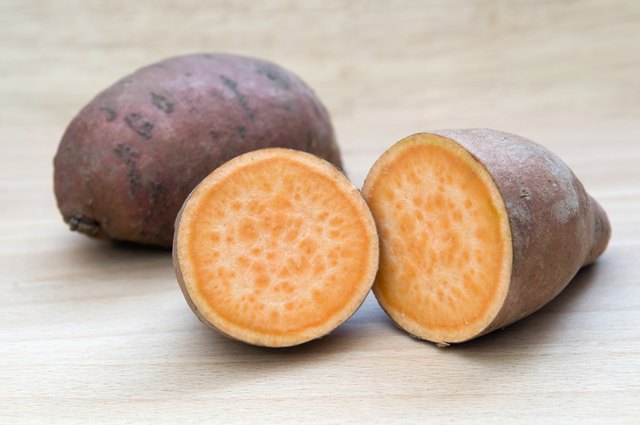 Sweet potatoes on chopping board